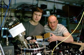 Dr Bjorn Lekitsch (left) and Prof Winfried Hensinger behind a quantum computer prototype at the University of Sussex.