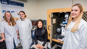 Professor Huabing Yin (seated) and her students with their JPK NanoWizard AFM with the CellHesion module at the University of Glasgow.