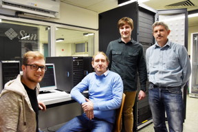  Siekmann, CAU
Using their supercomputer at Kiel University Niclas Schlnzen, Karsten Balzer, Jan-Philip Joost and Professor Michael Bonitz (from left) could describe, for the first time, the ultrafast electronic processes that are caused by energetic plasma ions hitting a nanostructured solid. Co-author Maximilian Rodriguez Rasmussen (not in the picture) also made a major contribution to the study.