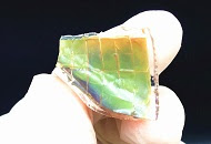 Inspired by chameleon skin, this flexible material changes color in response to heat and light.
Credit: Adapted from ACS Nano 2019, DOI: 10.1021/acsnano.9b04231