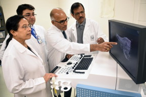 Study researchers Drs. Snigdha Banerjee, Suman Kambhampati, Sushanta Banerjee, and a colleague examine a pancreatic cancer image.

CREDIT
Jeff Gates