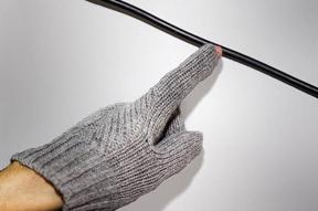 The fingertip of a wireless voltage detection glove illuminates when the wearer's hand approaches a live cable. Purdue University engineers have developed a method to transform existing cloth items into battery-free wearables resistant to laundry.

CREDIT
(Purdue University photo/Rebecca McElhoe)
