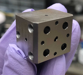 A niobium superconducting cavity. The holes lead to tunnels which intersect to trap light and atoms.

CREDIT
Aishwarya Kumar