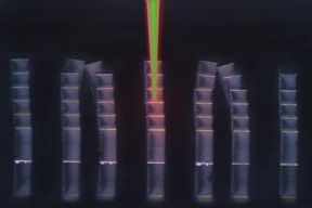This optical micrograph shows an array of microscopic metamaterial samples on a reflective substrate. Laser pulses have been digitally added, depicting pump (red) and probe (green) pulses diagnosing a sample in the center. The LIRAS technique sweeps through all samples on the substrate within minutes.

CREDIT
Courtesy of Carlos Portela, Yun Kai, et al